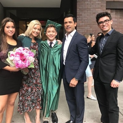 Joaquin with his parents and siblings on his graduation day.